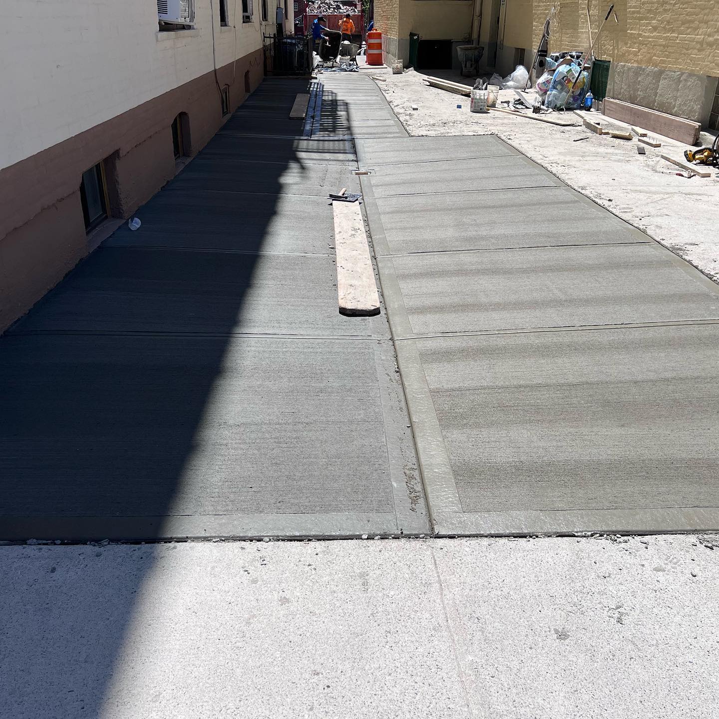 Protecting new sidewalk poured.